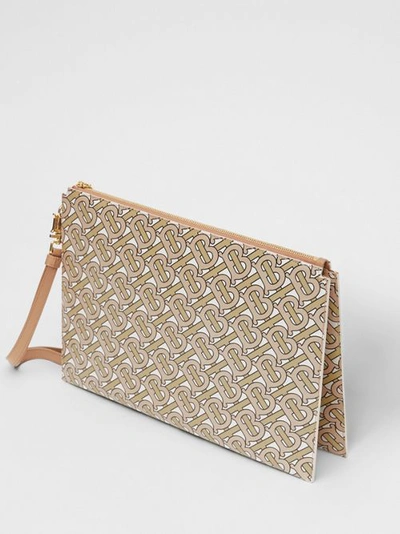 Shop Burberry Monogram Print Leather Pouch In Beige
