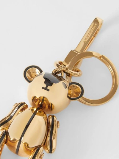 Shop Burberry Gold-plated Thomas Bear Charm In Black/light Gold