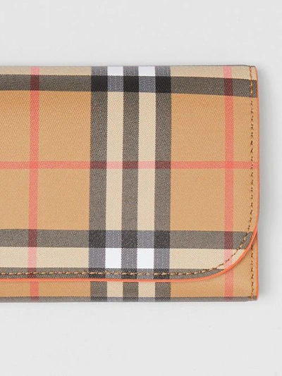 Shop Burberry Vintage Check Continental Wallet With Zip Card Case In Clementine