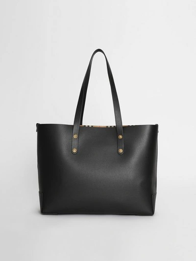 Shop Burberry Small Embossed Crest Leather Tote In Black
