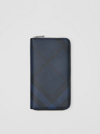 Shop Burberry London Check And Leather Ziparound Wallet In Navy/black