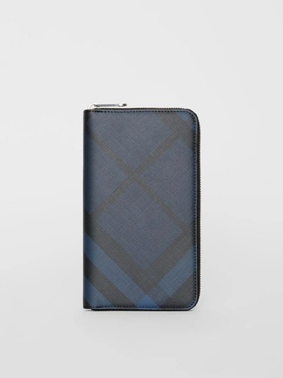 Shop Burberry London Check And Leather Ziparound Wallet In Navy/black