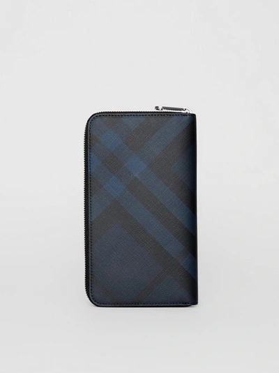 Shop Burberry London Check And Leather Ziparound Wallet In Navy/black