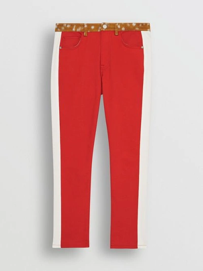 Shop Burberry Straight Fit Deer Print Trim Japanese Denim Jeans In Bright Red