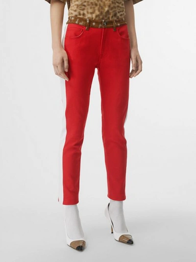 Shop Burberry Straight Fit Deer Print Trim Japanese Denim Jeans In Bright Red