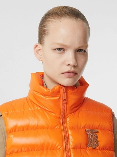Shop Burberry Icon Stripe Detail Down-filled Puffer Gilet In Orange