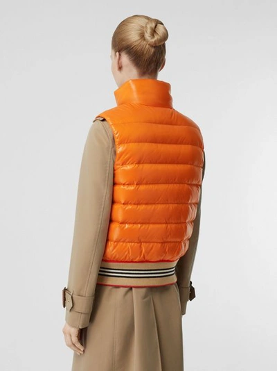 Shop Burberry Icon Stripe Detail Down-filled Puffer Gilet In Orange