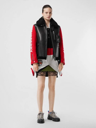 Shop Burberry Contrast Sleeve Leather And Shearling Jacket In Black