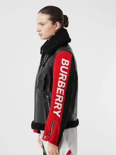 Shop Burberry Contrast Sleeve Leather And Shearling Jacket In Black