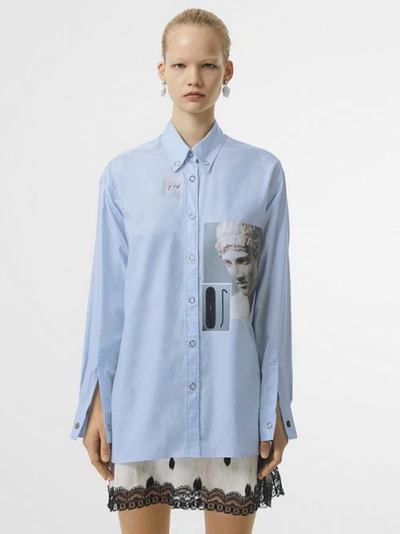 Shop Burberry Press-stud Collar Montage Print Oversized Shirt In Pale Blue