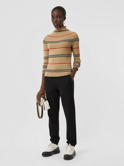 Shop Burberry Icon Stripe Cashmere Turtleneck Sweater In Archive Beige