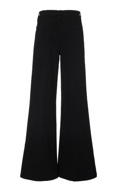 Shop Frame Le Palazzo High-rise Flared Jeans In Black
