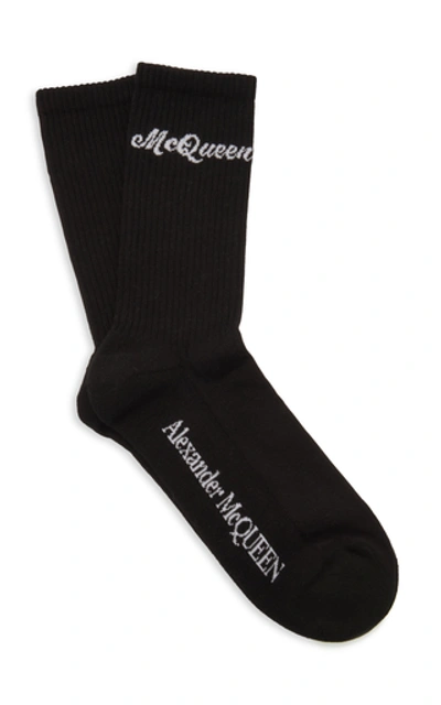 Shop Alexander Mcqueen Ribbed Logo-intarsia Stretch Cotton-blend Socks In Black