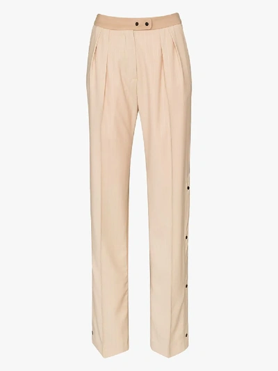 Shop Brøgger Elvie Buttoned Split Leg Wool Trousers In Neutrals