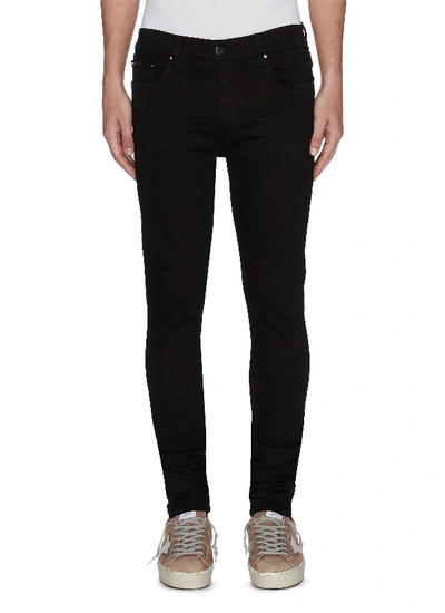 Shop Amiri Stacked Jeans In Black