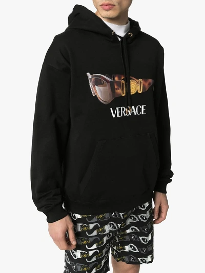 Shop Versace Sunglasses Logo Print Hoodie In Black