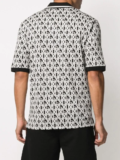 Shop Dolce & Gabbana All-over Dg Print Polo Shirt In Black