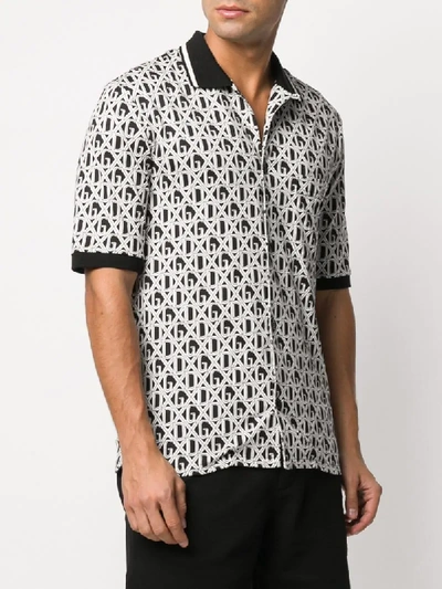 Shop Dolce & Gabbana All-over Dg Print Polo Shirt In Black