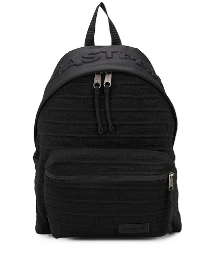 Shop Eastpak All-over Embossed Logo Backpack In B11 Black