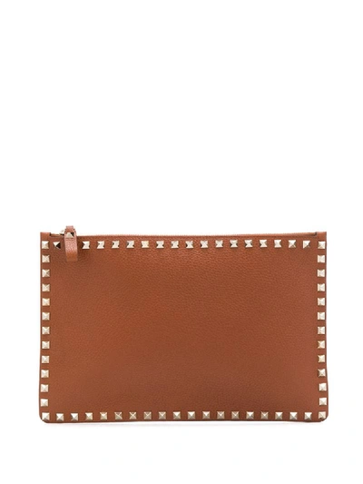 Shop Valentino Rockstud Clutch Bag In Brown