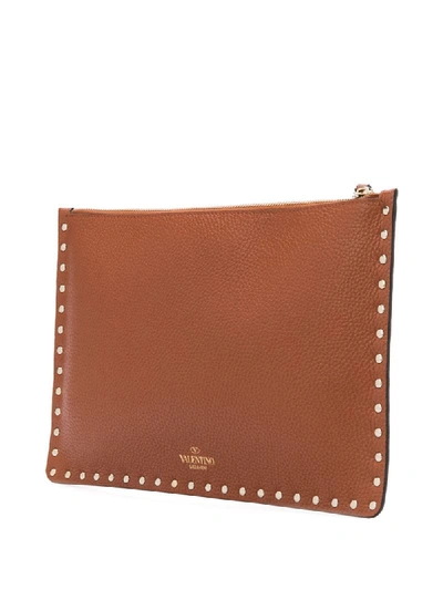 Shop Valentino Rockstud Clutch Bag In Brown