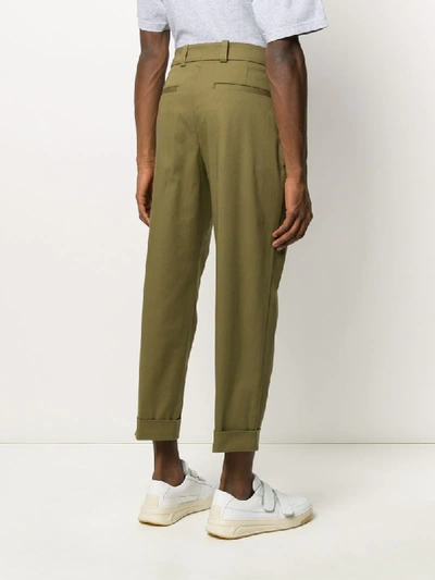 Shop Acne Studios Cropped Tapered Trousers In Green