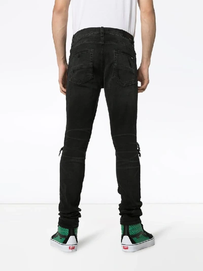 Shop Amiri 'mx1' Jeans In Distressed-optik In Black