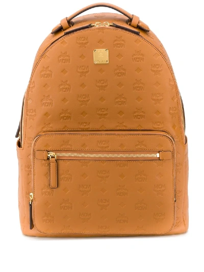 Shop Mcm Stark Embossed-logo Backpack In Brown