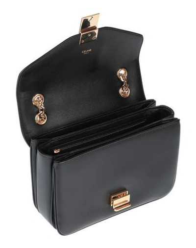 Shop Celine Handbags In Black