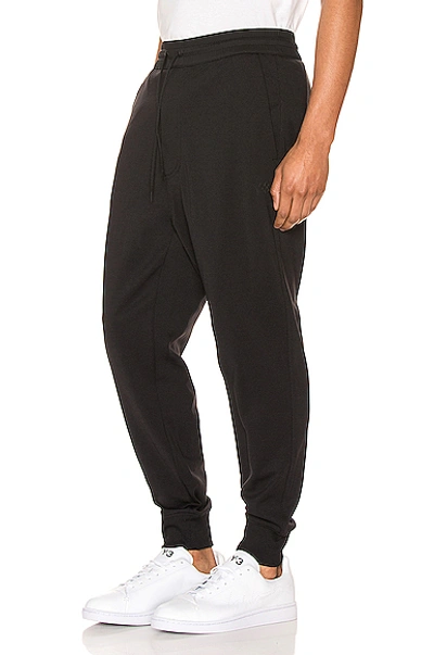 Shop Y-3 Cuffed Trackpants In Black