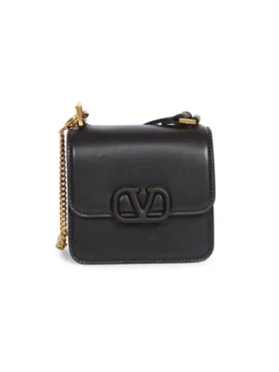 Shop Valentino Micro Vsling Leather Crossbody Bag In Black