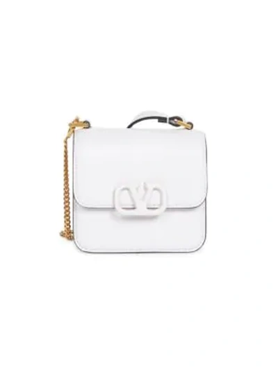 Shop Valentino Micro Vsling Leather Crossbody Bag In White