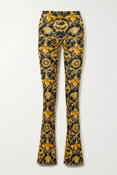 Shop Versace Printed Stretch-jersey Flared Pants In Black