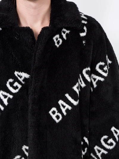 Shop Balenciaga All Over Logo Coat In Black
