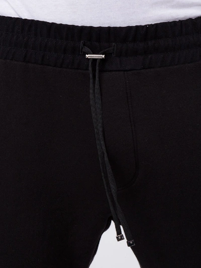 Shop Amiri Black Cotton Tapered Track Pants