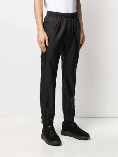 Shop Versace Black Logo Tape Track Pants
