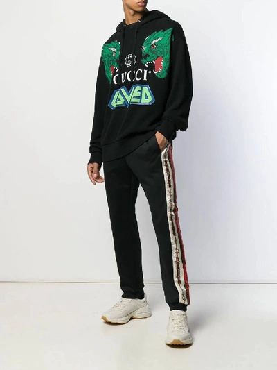 Shop Gucci Printed Side Stripe Track Pants In Black