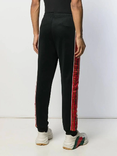 Shop Gucci Printed Side Stripe Track Pants In Black