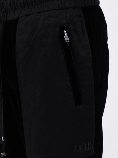 Shop Amiri Velvet Commando Sweatpants Black