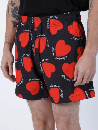 Shop Amiri Hearts Swimming Trunks In Black