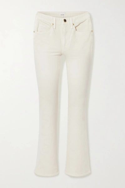 Shop Khaite Vivian Cropped High-rise Bootcut Jeans In Ivory