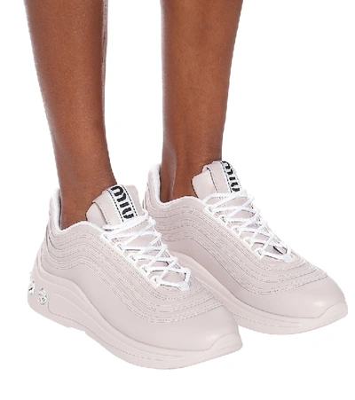 Shop Miu Miu Embellished Leather Sneakers In Beige