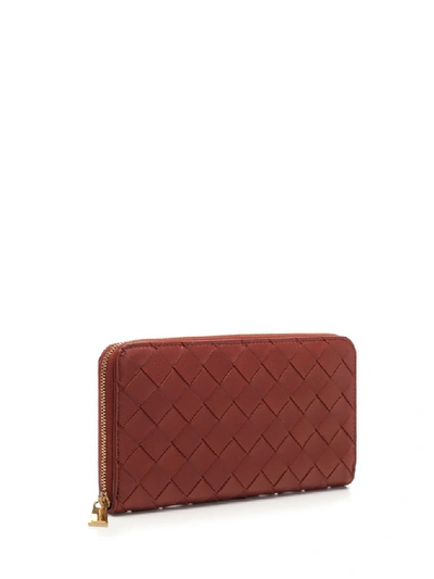 Shop Bottega Veneta Zipped Intrecciato Wallet In Red