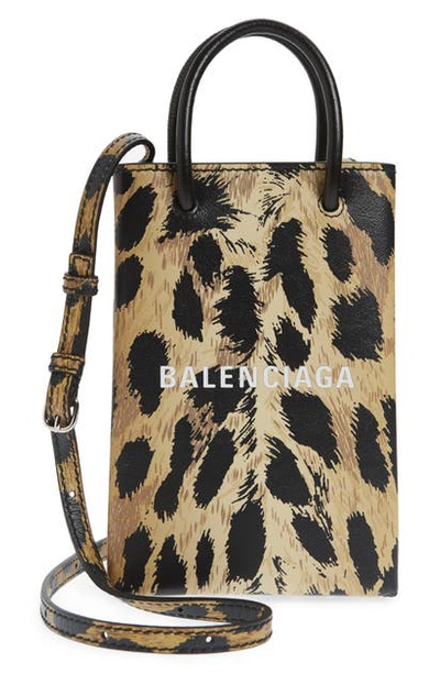 Shop Balenciaga Shopping Leather Crossbody Phone Bag In Brown