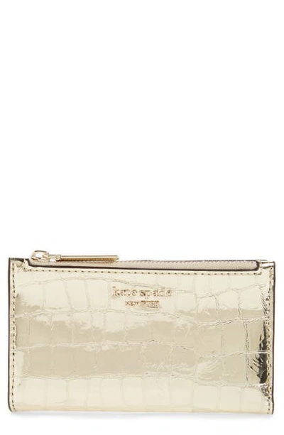 Shop Kate Spade Sylvia Croc Embossed Leather Slim Bifold Wallet In Gold