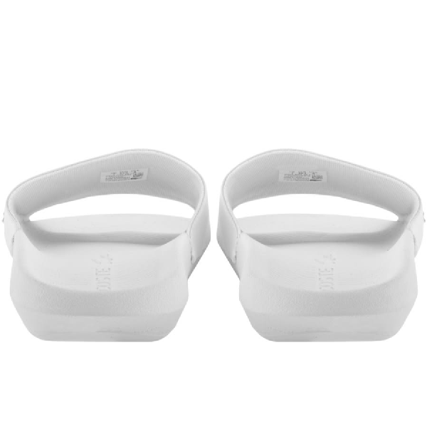 white lacoste sliders