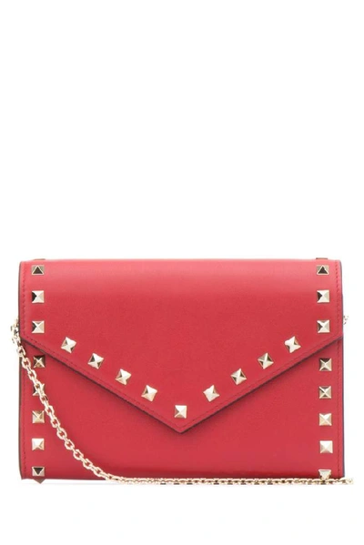 Shop Valentino Garavani Rockstud Envelope Clutch Bag In Red