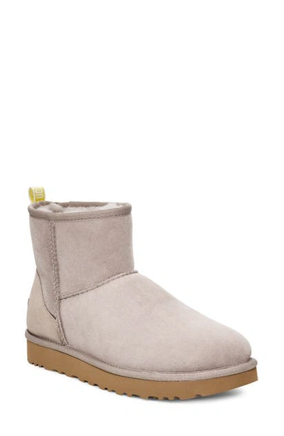 Shop Ugg Classic Mini Ii Logo Bootie In Oyster / Neon Yellow Suede