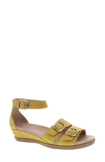 Shop Dansko Astrid Wedge Sandal In Yellow Nubuck Leather