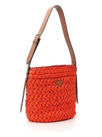 Shop Prada Woven Logo Bucket Bag In Orange